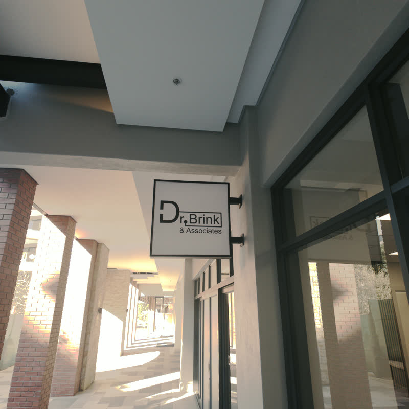 Dr Brink and Associates sign mounted above the covered entrance walkway